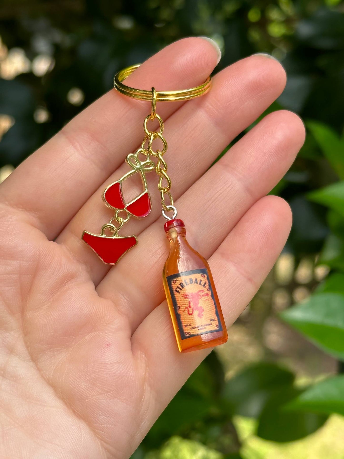 fireball keychain with red bikini metal charms bold fun gift for her