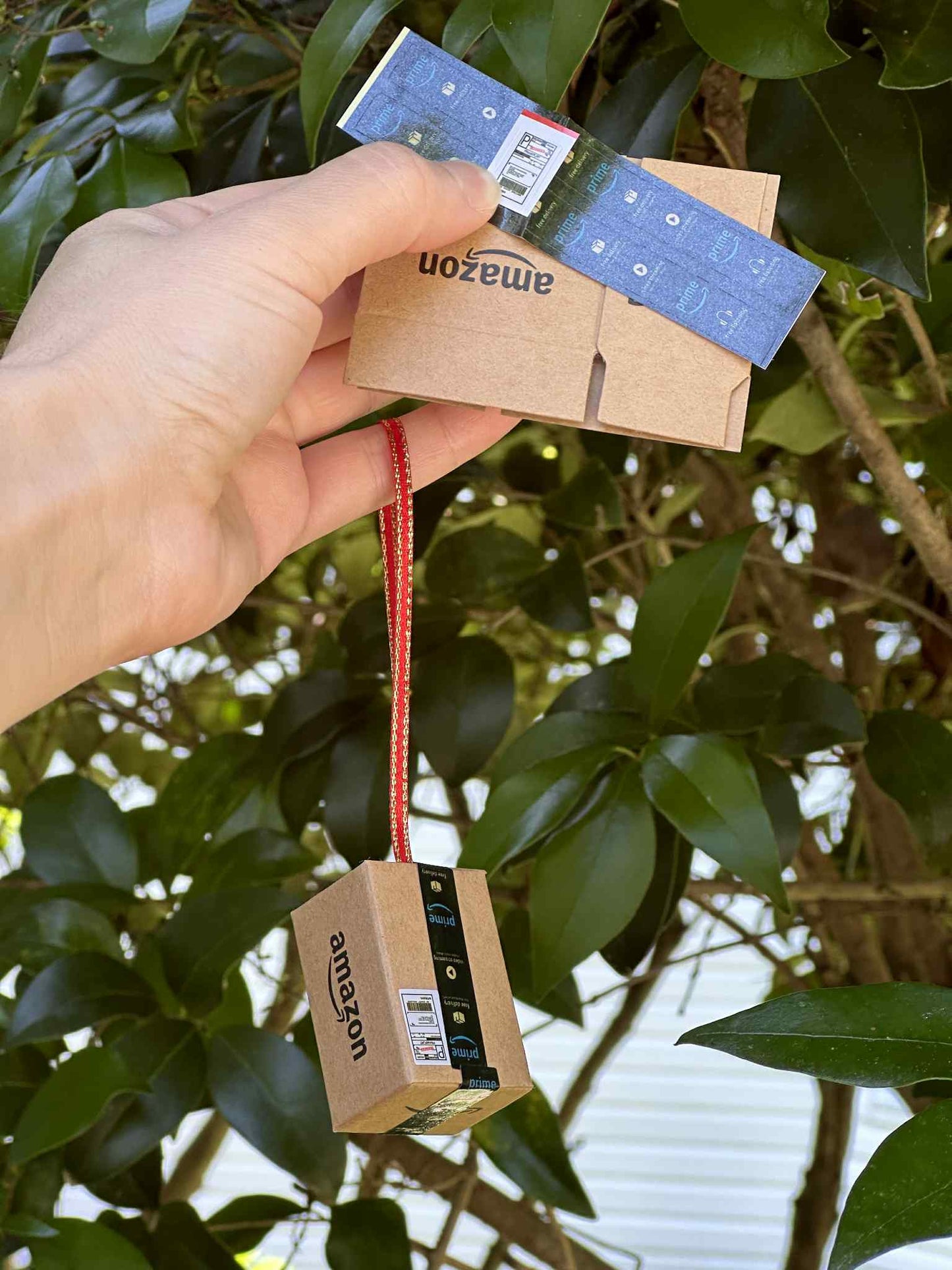 Celebrate the joy of unboxing with this quirky Amazon Box Inspired Ornament, perfect gift for online shopping lovers, playful touch to holiday, office spaces