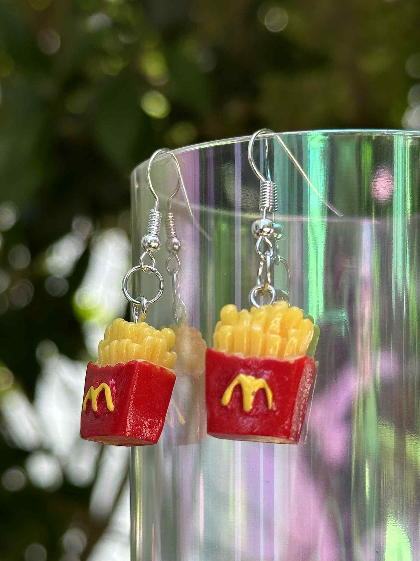 French fries drop earrings made of resin, fun novelty jewelry for fast-food lovers and fashion boutiques.