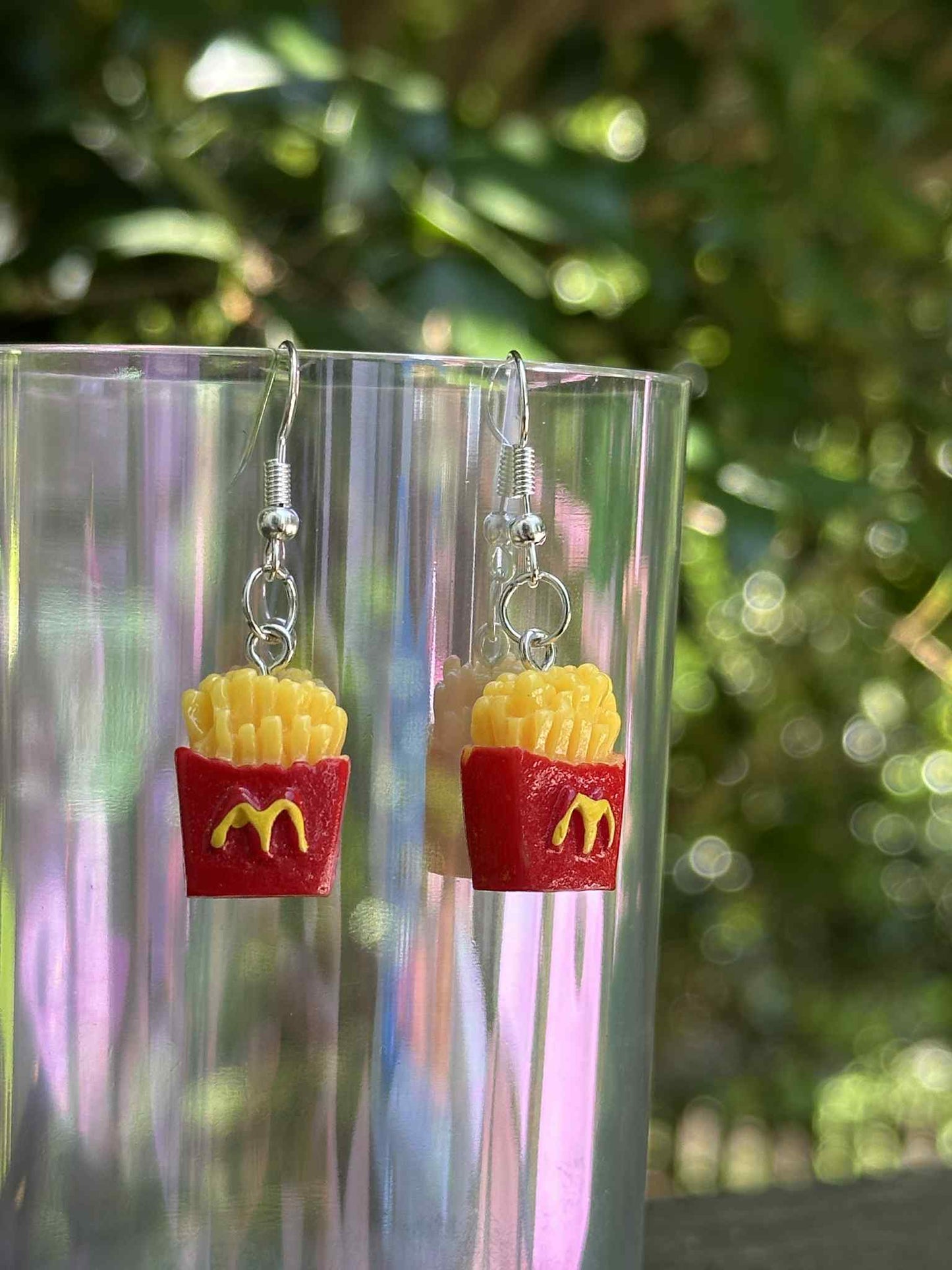 French fries drop earrings made of resin, fun novelty jewelry for fast-food lovers and fashion boutiques.