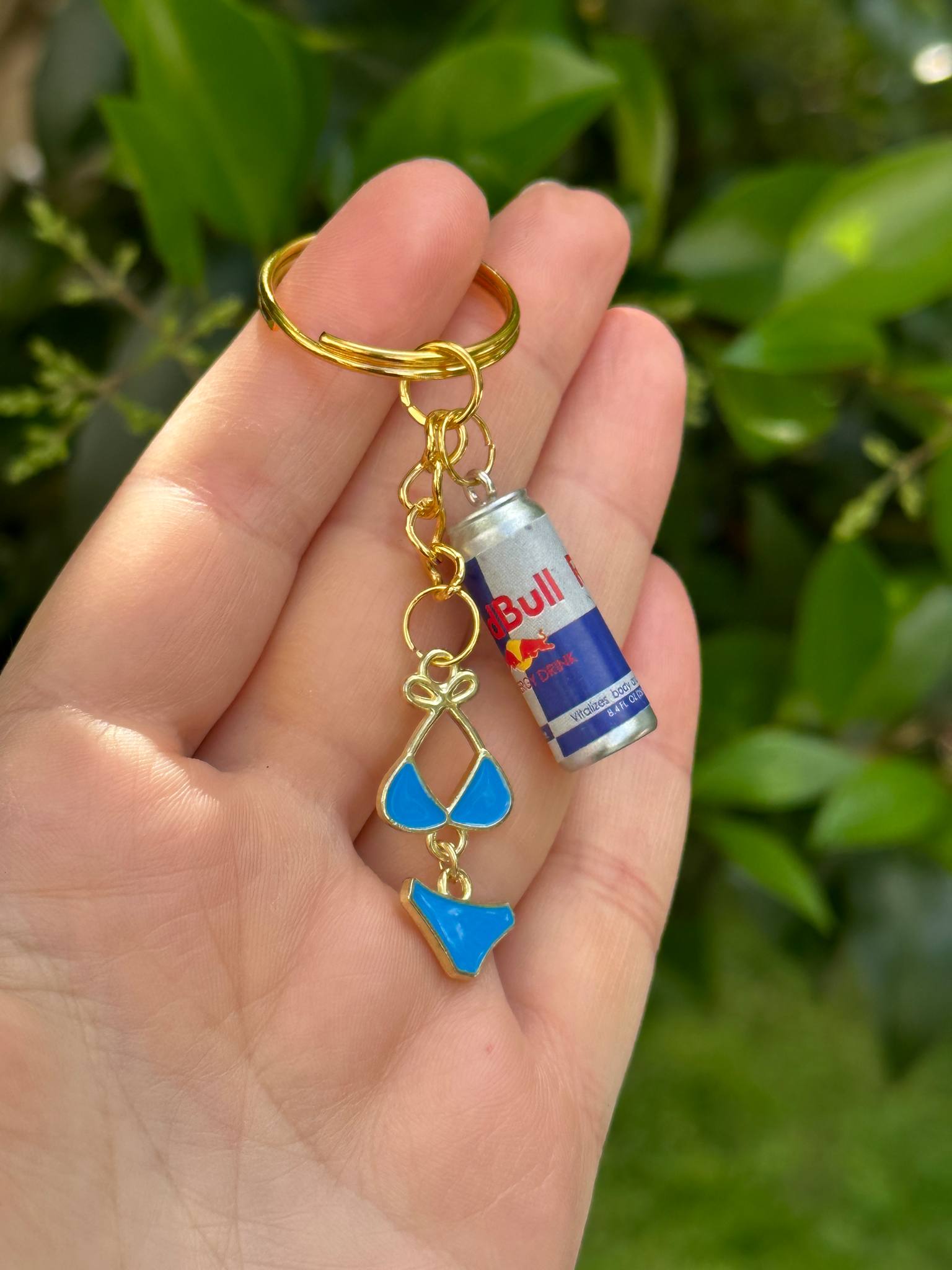 red bull and blue bikini charm keychain for party and energy lovers