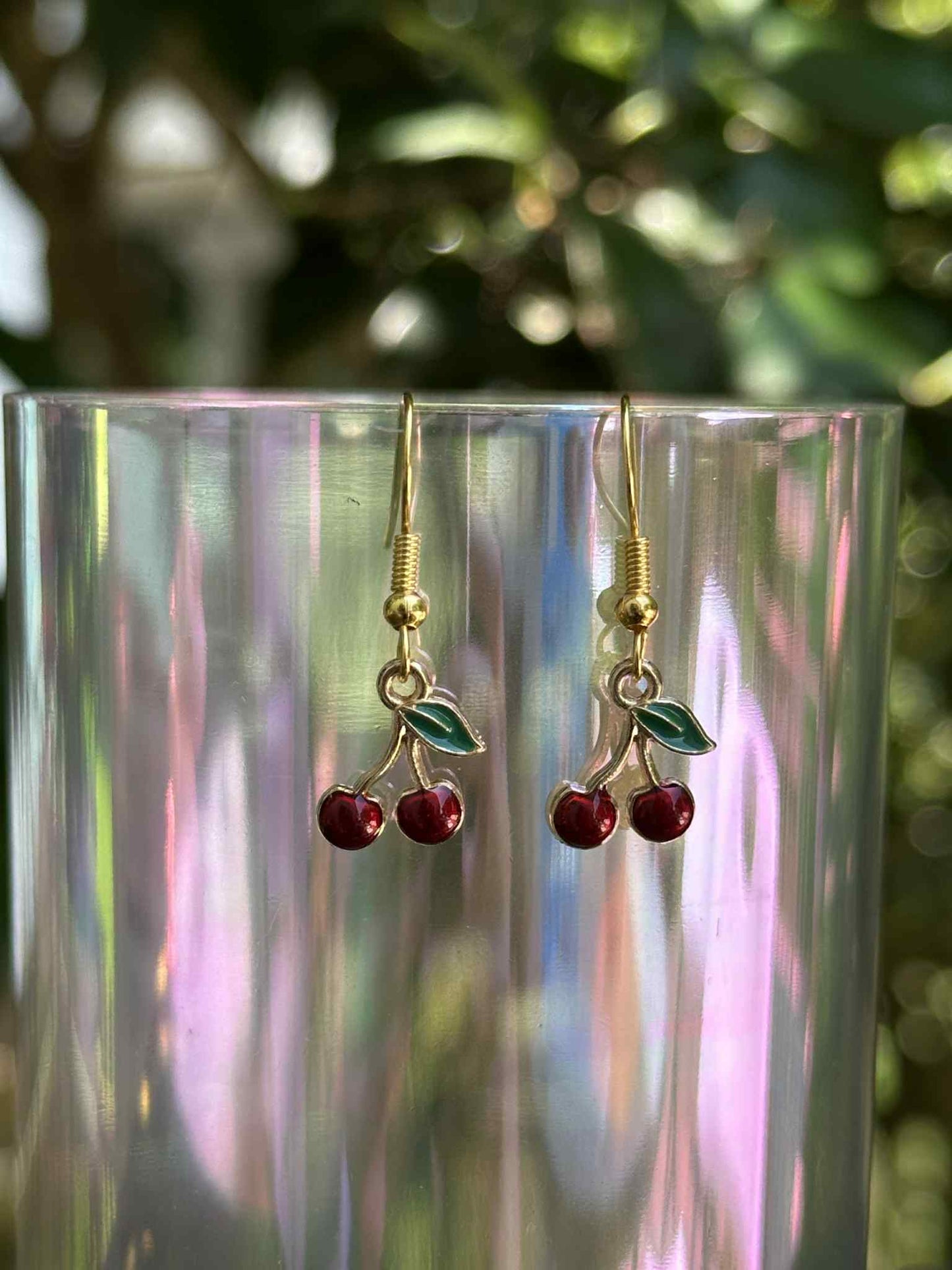 Cherry drop earrings with red resin fruit design, lightweight and trendy accessory for women.