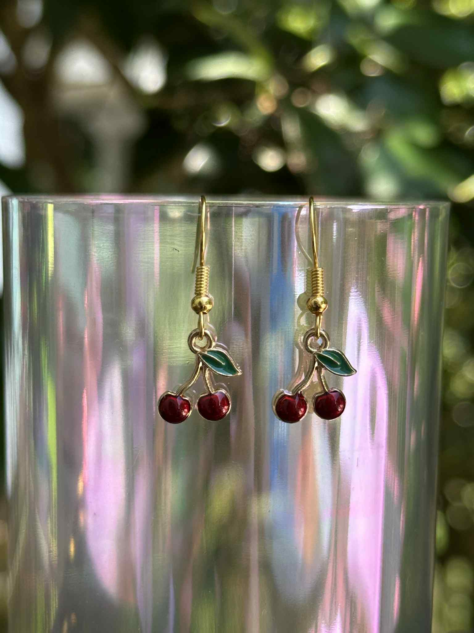 Cherry drop earrings with red resin fruit design, lightweight and trendy accessory for women.