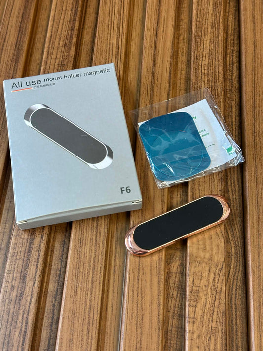 All use mount holder magnetic F6 packaging on a wooden surface with a black and rose gold mount.