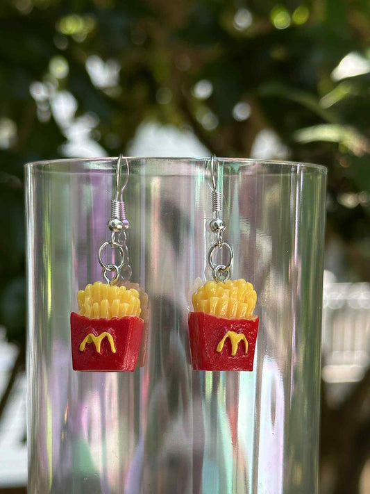 French fries drop earrings made of resin, fun novelty jewelry for fast-food lovers and fashion boutiques.