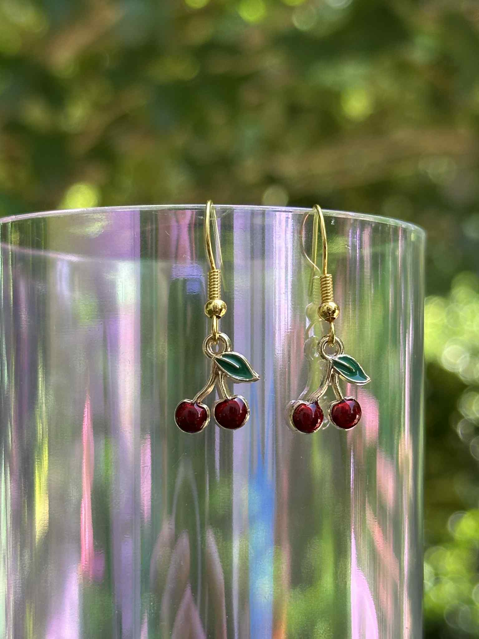 Cherry drop earrings with red resin fruit design, lightweight and trendy accessory for women.